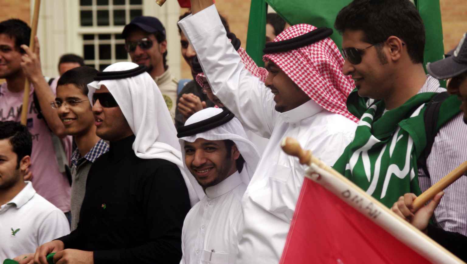 International students celebrating with flags