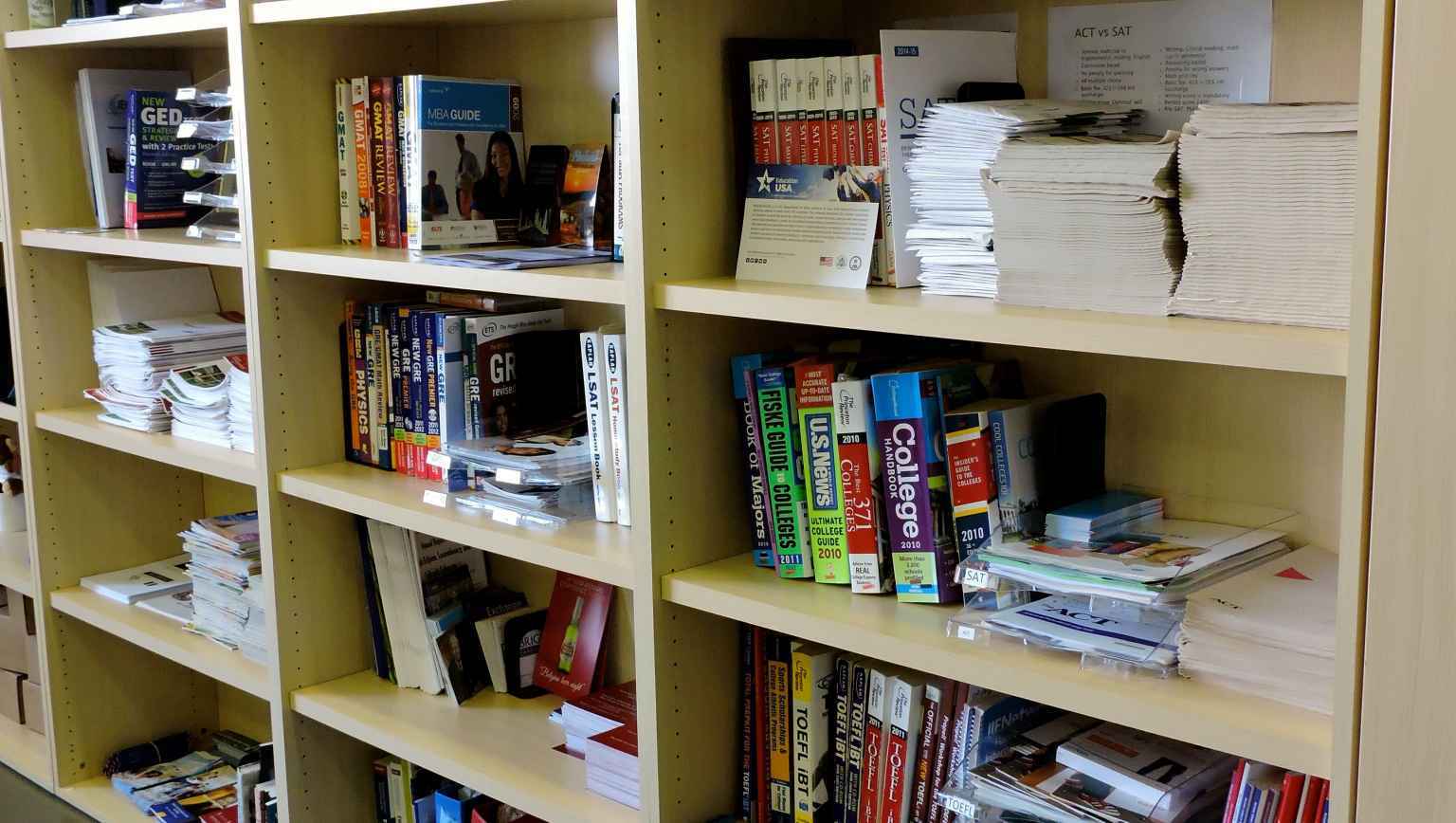 Bookshelf full of EducationUSA resources (books)
