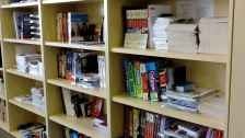 Bookshelf full of EducationUSA resources (books)