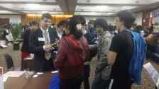 International students at US college fairs meeting with advisors and representatives 