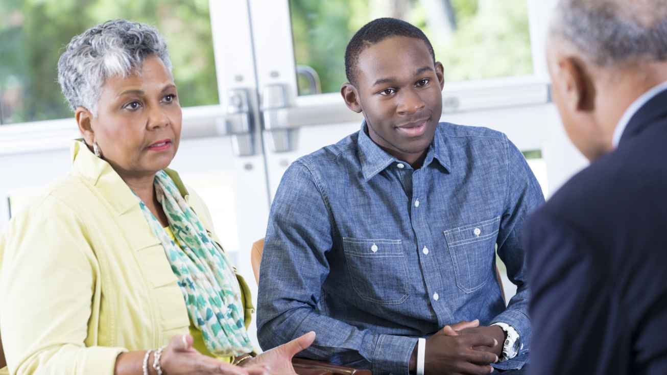 international student and parents meeting with adviser