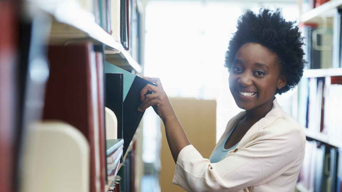 international student researching in library