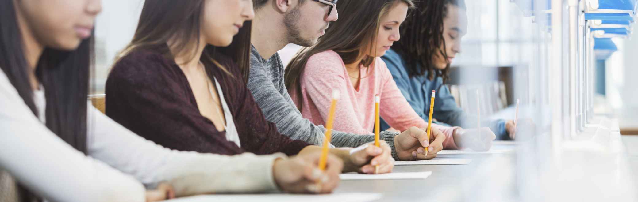 international students researching and taking notes on study opportunities in the USA