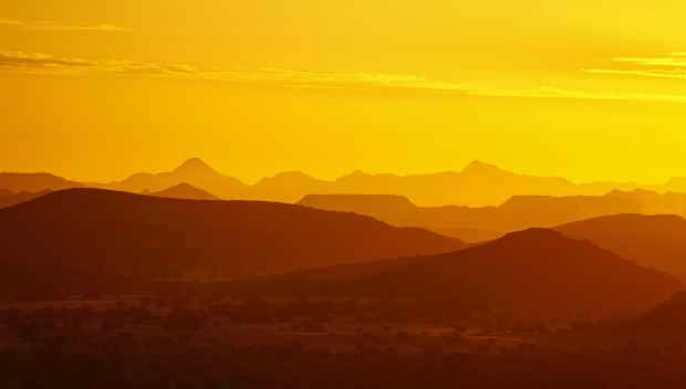 Scenic graphic of mountain tops with a sunset